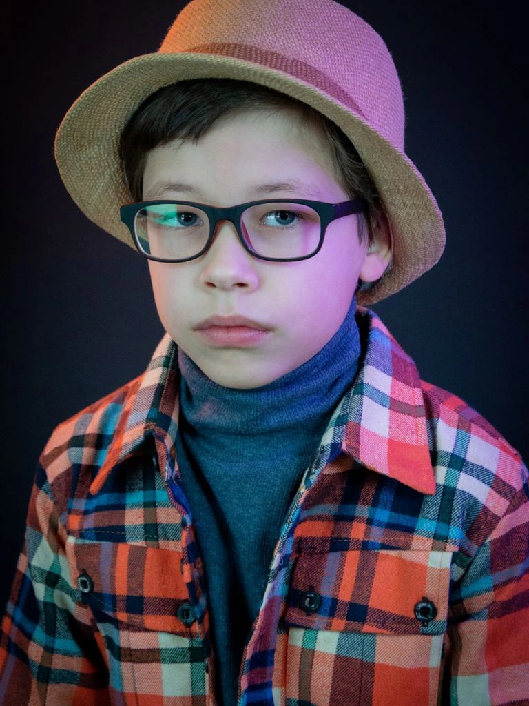 Model wearing oversized tortoiseshell acetate frames in editorial portrait